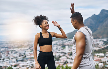 Image showing Theyre pumped with so much energy. Shot of a sporty young couple high fiving each other while exercising outdoors.