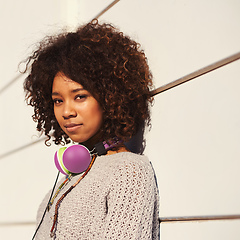 Image showing Music is my culture. A young woman with headphones around her neck.