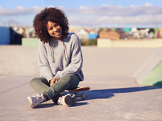 Image showing Its a great day to skate. Shot of a young woman in a skate park.