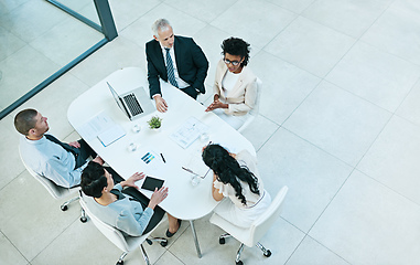 Image showing Voicing her ideas. High angle shot of a group of businesspeople having a meeting.