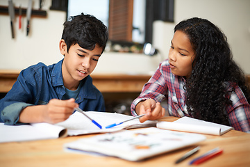 Image showing Growing through a good education. Shot of two young students studying together in a classroom.