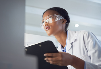 Image showing Every contribution is a contribution that matters. Shot of a young scientist using a computer while conducting research in a laboratory.