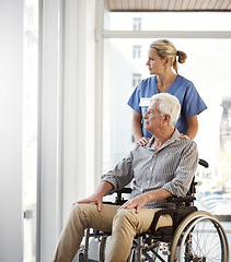 Image showing Making sure hes not cooped up in his recovery room. Cropped shot of a mature female nurse and her senior male wheelchair-bound patient in the hospital.