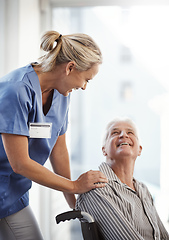 Image showing Where to, mister. Cropped shot of a mature female nurse and her senior male wheelchair-bound patient in the hospital.