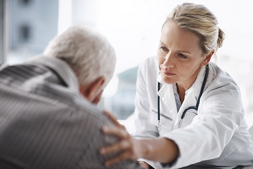 Image showing Well get through this. Cropped shot of a mature female doctor working with a senior male patient in her office in the hospital.