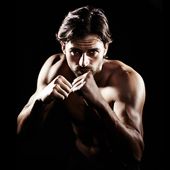 Image showing Put your fists up. Portrait of a muscular young boxer standing ready to fight.