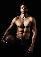 Image showing His skills and body are honed to perfection. Cropped image of a muscular young man holding a soccerball.