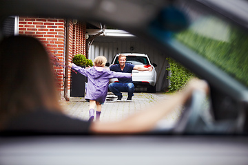 Image showing Shes happy to be home. Shot of a little girl running towards her father.