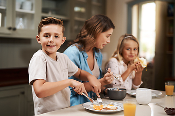 Image showing Its breakfast time. Cropped shot of a young family having breakfast at home.