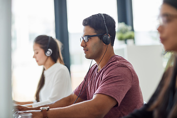 Image showing They are on the front line of customer service. Shot of a group of customer service representatives working at a desk.