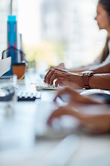 Image showing Finding solutions to your problems. Cropped shot of a group of workers sitting at their desk.