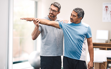 Image showing It all starts with a stretch. Shot of a senior man going through rehabilitation with his physiotherapist.