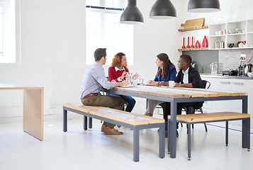 Image showing Lets get down to business. Full length shot of a group of businesspeople in a meeting.