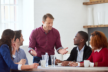 Image showing So thats my plan. Cropped shot of a handsome businessman addressing his colleagues during a business meeting.