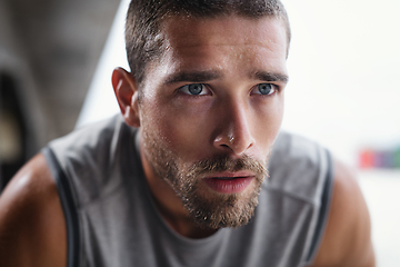 Image showing Keep your eyes locked in on the prize. Shot of handsome young sportsman taking a break while exercising outdoors.