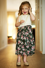 Image showing Shes an adorable little busy bee. Shot of an adorable little girl playing dress-up at home.