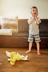 Image showing Mom is going to be so mad about this. Shot of a little boy looking shocked after breaking a vase at home.