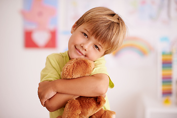 Image showing Childhood moments. Portrait of a cute little boy hugging his stuffed animal.