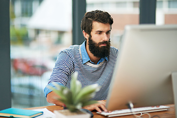 Image showing This is what the new age of business looks like. Cropped shot of a creative businessman working on his computer in the office.