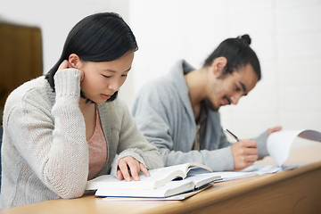 Image showing This test could change their lives for the worse or for the better.... Image of two students sitting in a lecture hall and studying for exams.