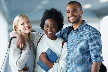 Image showing Making connections while they are still in College. Portrait of smiling University students arm in arm.