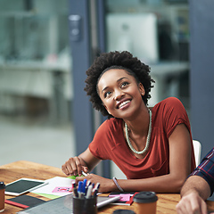 Image showing Nothing compares to seeing her ideas realized. Cropped shot of a creative businesswoman looking happy at a meeting.