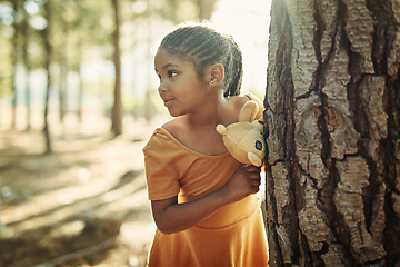 Image showing If we go out to the woods today.... Shot of a little girl playing in the woods with her teddybear.