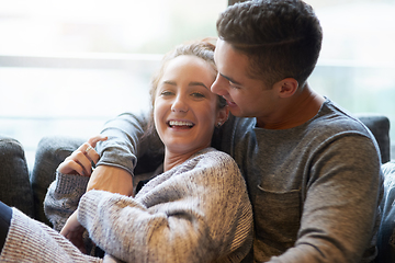 Image showing Weekends are best when were together. Shot of an affectionate young couple relaxing on the sofa at home.