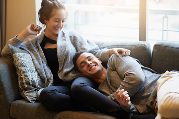 Image showing The lap of love. Portrait of a handsome young man lying on his girlfriends lap on the sofa.