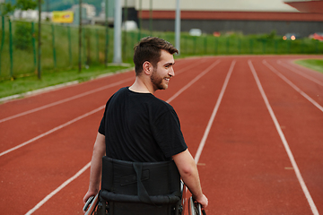 Image showing A person with disability in a wheelchair training tirelessly on the track in preparation for the Paralympic Games