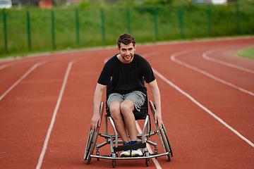 Image showing A person with disability in a wheelchair training tirelessly on the track in preparation for the Paralympic Games