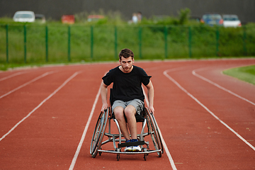 Image showing A person with disability in a wheelchair training tirelessly on the track in preparation for the Paralympic Games