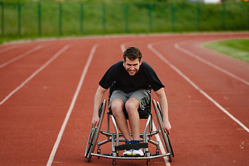 Image showing A person with disability in a wheelchair training tirelessly on the track in preparation for the Paralympic Games