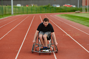 Image showing A person with disability in a wheelchair training tirelessly on the track in preparation for the Paralympic Games