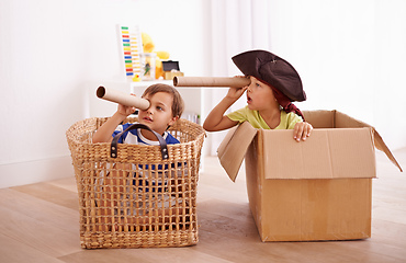 Image showing Whats that over there. Shot of two little boys pretending to be pirates in their bedroom.