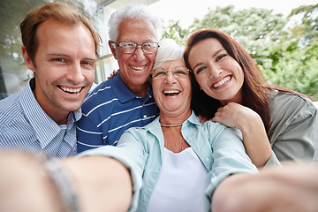 Image showing The generation of selfies. Cropped shot of four adults taking a family selfie.