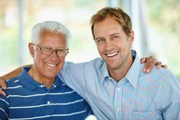 Image showing Like father, like son. Portrait of a father and son sitting together.