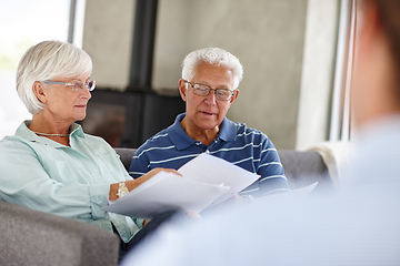 Image showing Save a penny, earn a penny. Over-the-shoulder shot of a financial advisor meeting with a senior couple at their home.