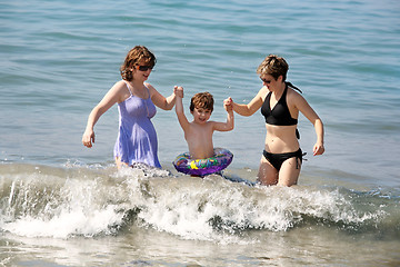 Image showing Two women and a baby