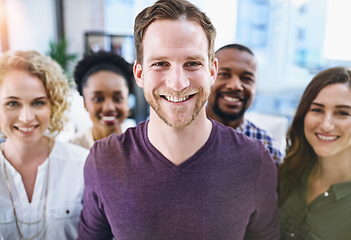 Image showing Were definitely a passionate team of creatives. Portrait of a team of designers standing together in the office.