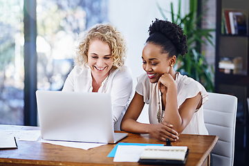 Image showing Merging their creative flair to accomplish the task at hand. Cropped shot of two designers working together in the office.