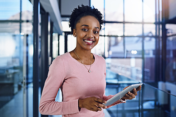 Image showing Success has no limit so keep pushing yourself further. Portrait of a young businesswoman working on a digital tablet in the office.