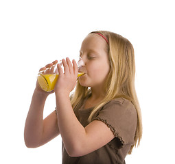 Image showing Thirsty Girl Drinking Orange Juice