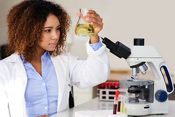 Image showing Waiting for the solution to reveal itself. Cropped shot of a young female scientist conducting an experiment in the lab.