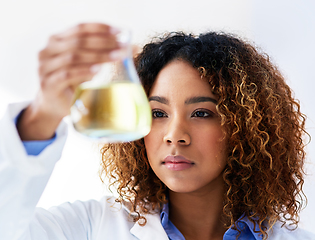 Image showing Searching for a solution. Cropped shot of a young female scientist conducting an experiment in the lab.