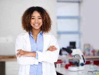 Image showing Ill find the cure. Portrait of an attractive young scientist standing with her arms folded in the lab.