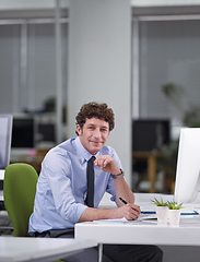 Image showing Hes a ver diligent worker. Cropped shot of a young businessman sitting at his desk.