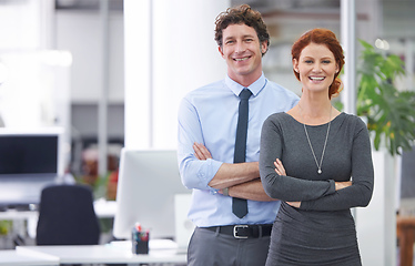 Image showing They make a great business team. Cropped shot of two colleagues standing in an office.