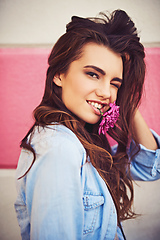 Image showing There are so many beautiful reasons to be happy. Portrait of a beautiful young woman posing against a wall outside.