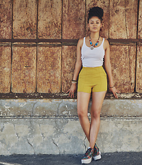 Image showing Citified style. Portrait of an attractive and trendy young woman posing against an urban background.